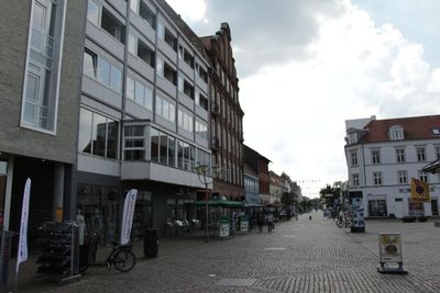 Street in city against sky