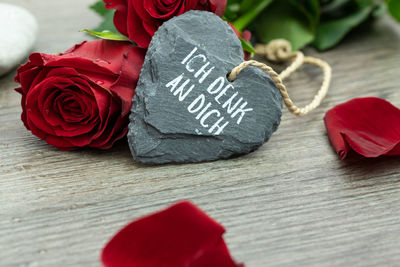 Close-up of red rose on table