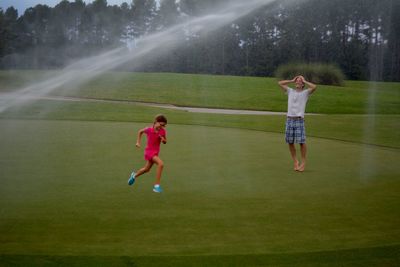 Family enjoying at golf course