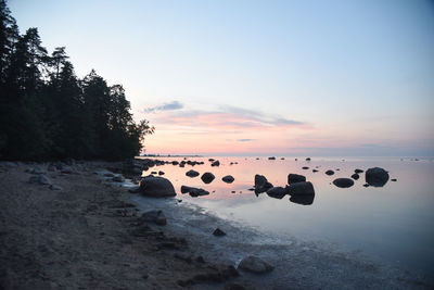 Scenic view of rocks against sky during sunset