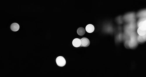 Low angle view of moon against dark sky