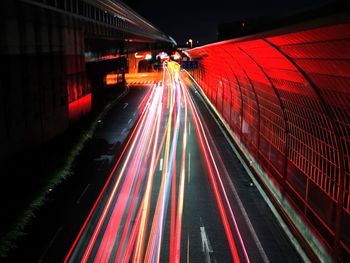 Light trails on road in city at night