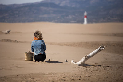 Rear view of woman on beach