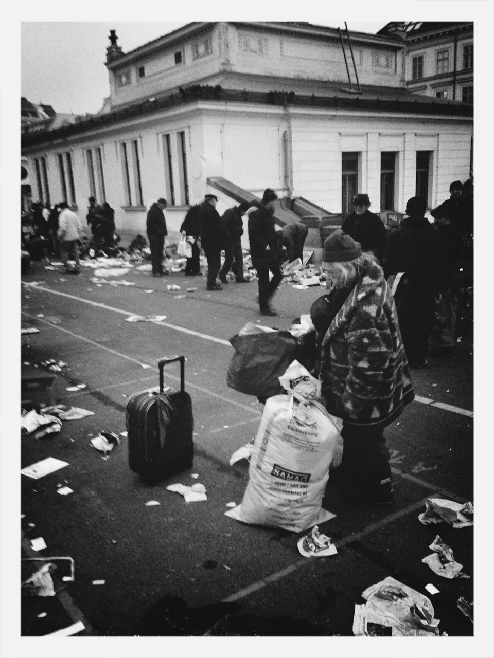 transfer print, auto post production filter, men, lifestyles, person, street, large group of people, building exterior, leisure activity, walking, architecture, built structure, city life, city, togetherness, full length, outdoors, day, medium group of people