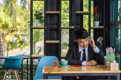 Portrait of man sitting in restaurant