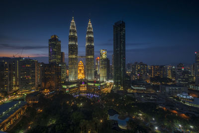 Illuminated buildings in city at night