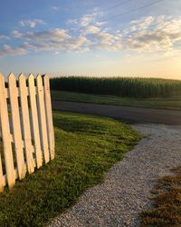 Scenic view of field against sky during sunset