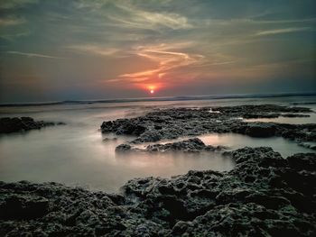 Scenic view of sea against sky during sunset