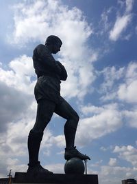 Low angle view of statue against sky