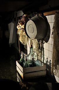 Close-up of old machine part hanging on table