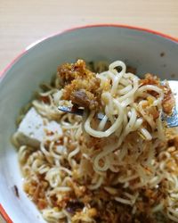 Close-up of noodles served in bowl on table