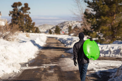 Rear view of man walking outdoors