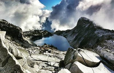 Scenic view of mountains against cloudy sky