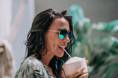 Portrait of a smiling young woman holding ice cream