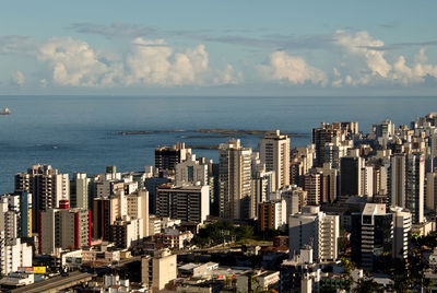 City skyline with sea in background