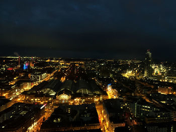 High angle view of illuminated buildings in city at night