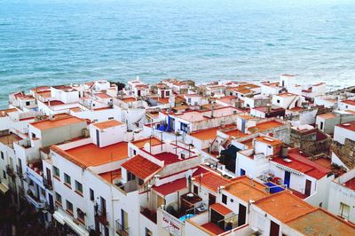 High angle view of town by sea