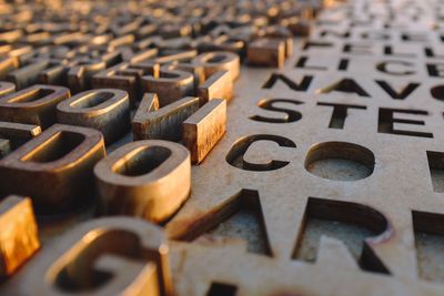 High angle view of old metallic alphabets