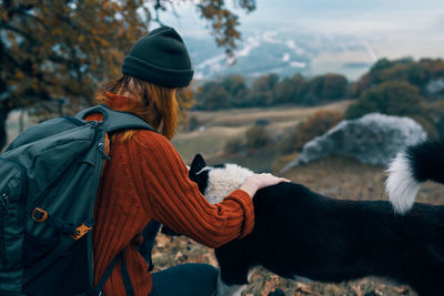 Rear view of woman with umbrella