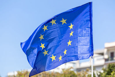 Low angle view of flag against sky