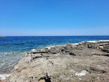 Scenic view of sea against clear sky