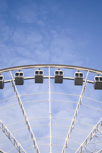 Low angle view of telephone pole against blue sky