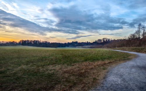 Scenic view of field against sky during sunset