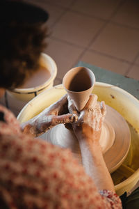 Cropped hand of person preparing food