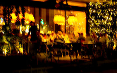 Group of people in restaurant at night