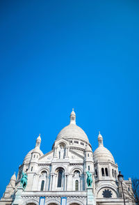 Low angle view of old building against clear sky