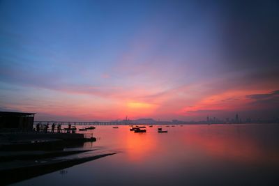 Scenic view of calm sea at sunset