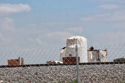 Building against sky seen through fence