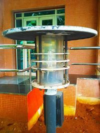 Close-up of fire hydrant on table against building