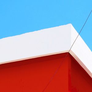 Low angle view of building against clear blue sky