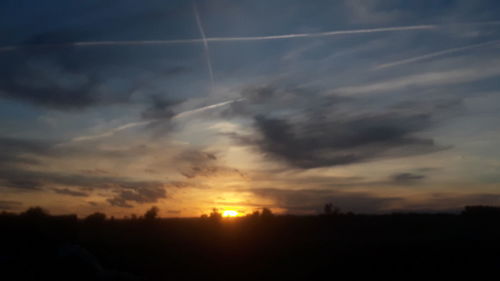 Scenic view of silhouette landscape against sky during sunset