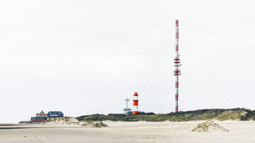 Lifeguard tower on beach against clear sky