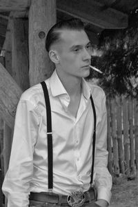 Portrait of man smoking outdoors