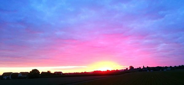 Scenic view of dramatic sky at sunset