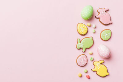 Directly above shot of pills on pink background