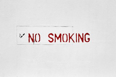 No smoking sign on white wall