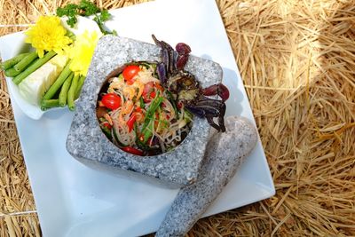 Close-up of seafood served in mortar on tray