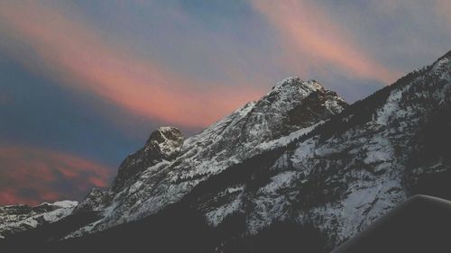 Close-up of mountains against sky during sunset