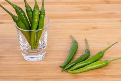 High angle view of green chili pepper on table