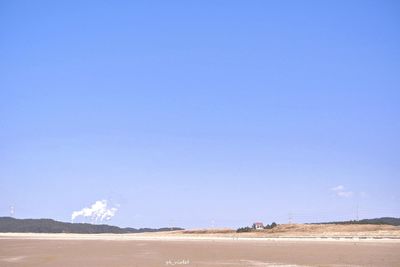 Scenic view of landscape against clear blue sky