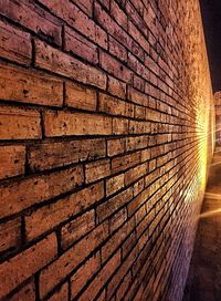 Close-up of illuminated brick wall