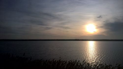 Scenic view of sunset over river