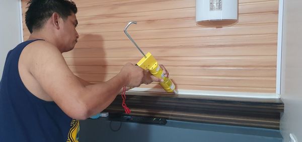 Midsection of man working at home