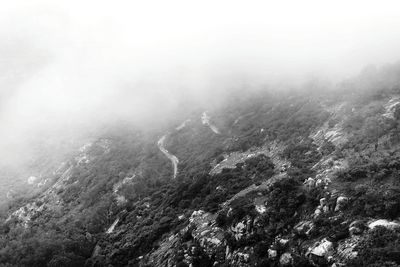 Scenic view of mountains in foggy weather