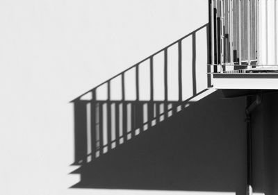 House wall with shadow from balcony