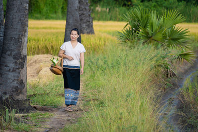 Full length portrait of man standing on land